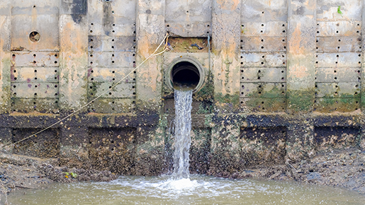 Water pouring out of drain into water